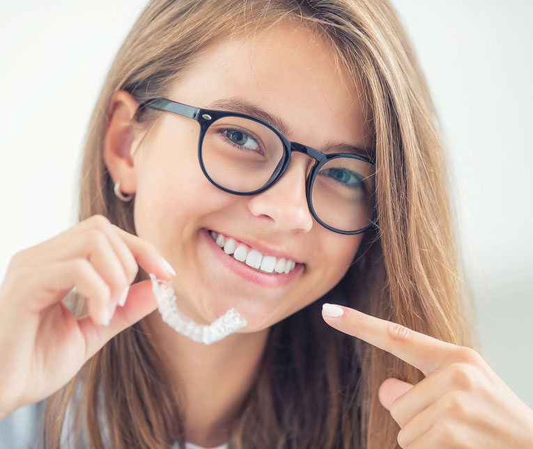 woman with aligner